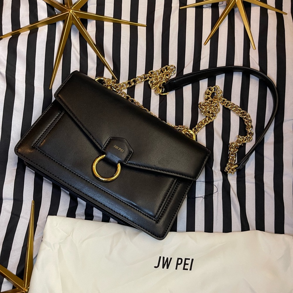 JW PEI black purse with gold accents